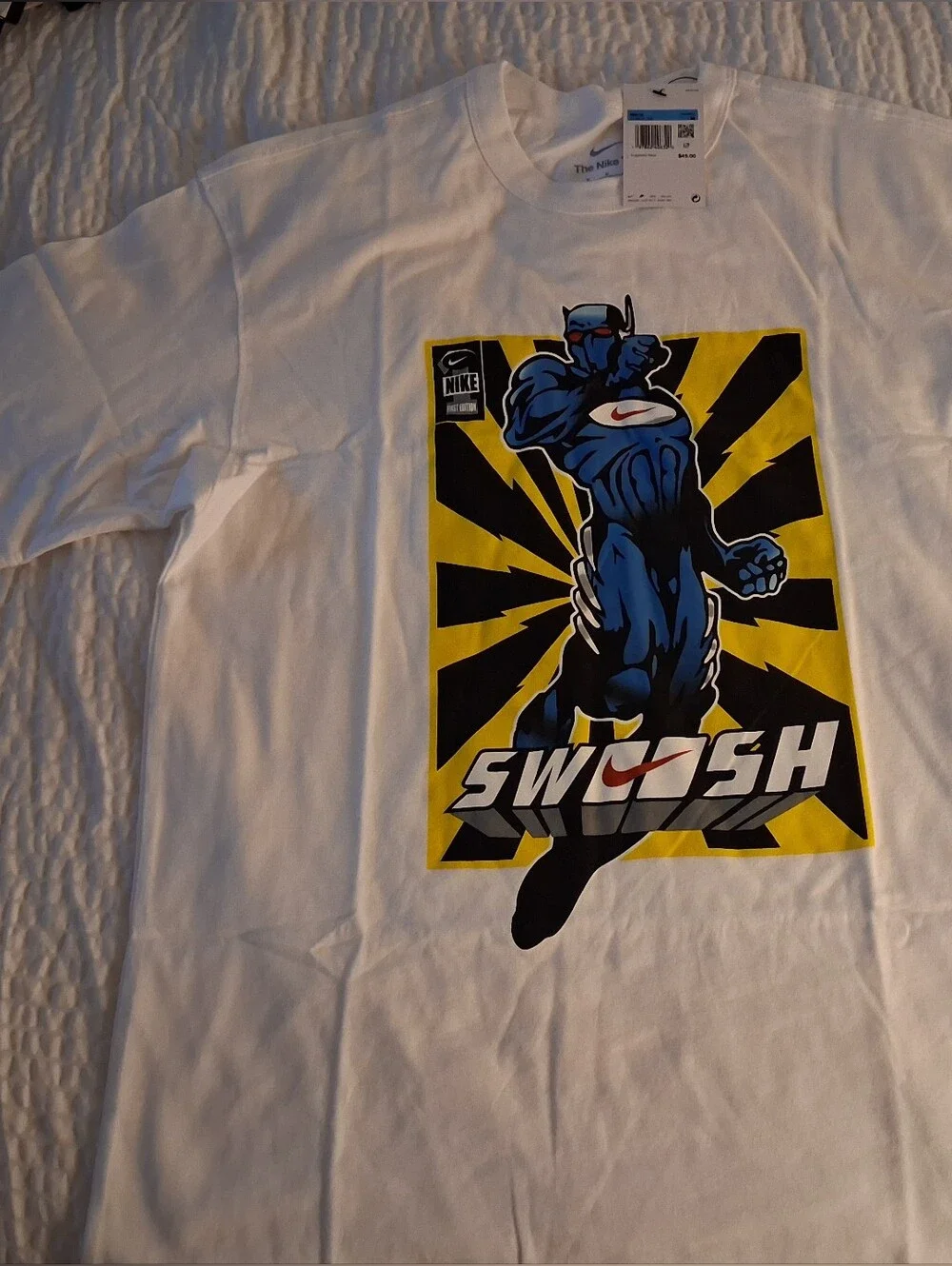 Nike White Short-Sleeve Tee with Blue Comic Graphic and Yellow Accent